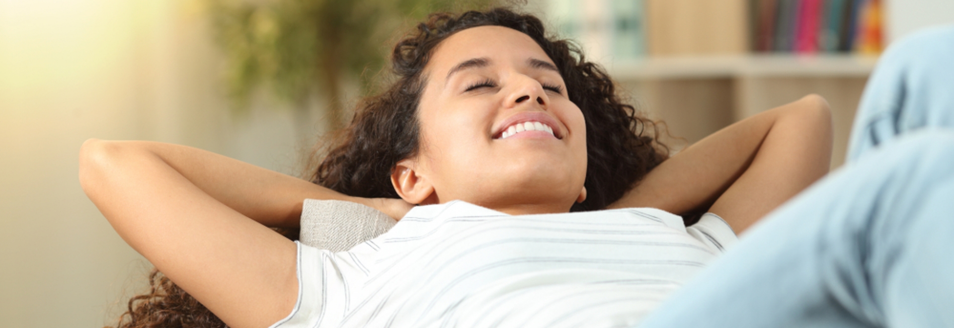 Woman Reclined on Couch Breathing In Fresh Air