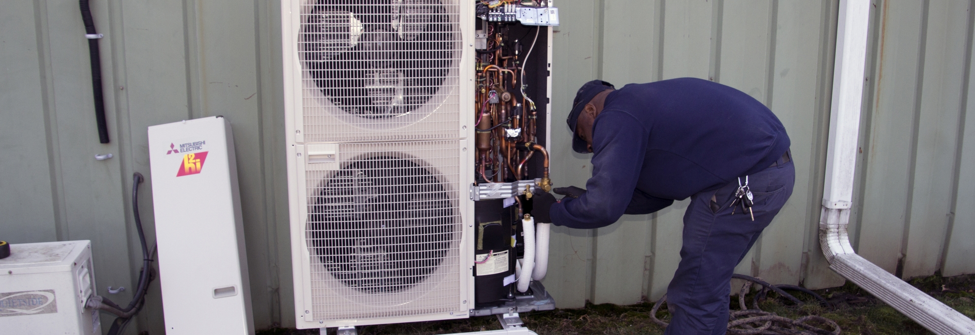 Princeton Technician Working on Heat Pump