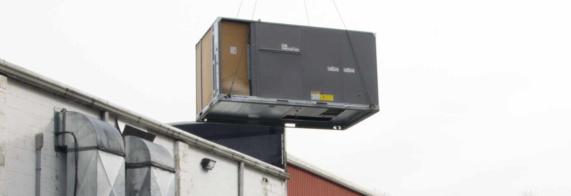 Commercial HVAC Unit Being Air Lifted By Crane