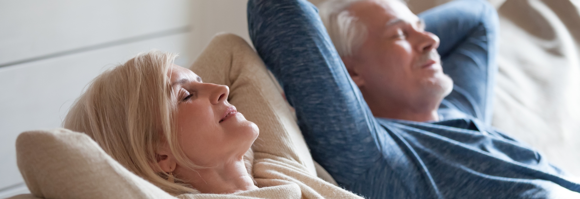 Older Couple Laid Back And Breathing Fresh Air