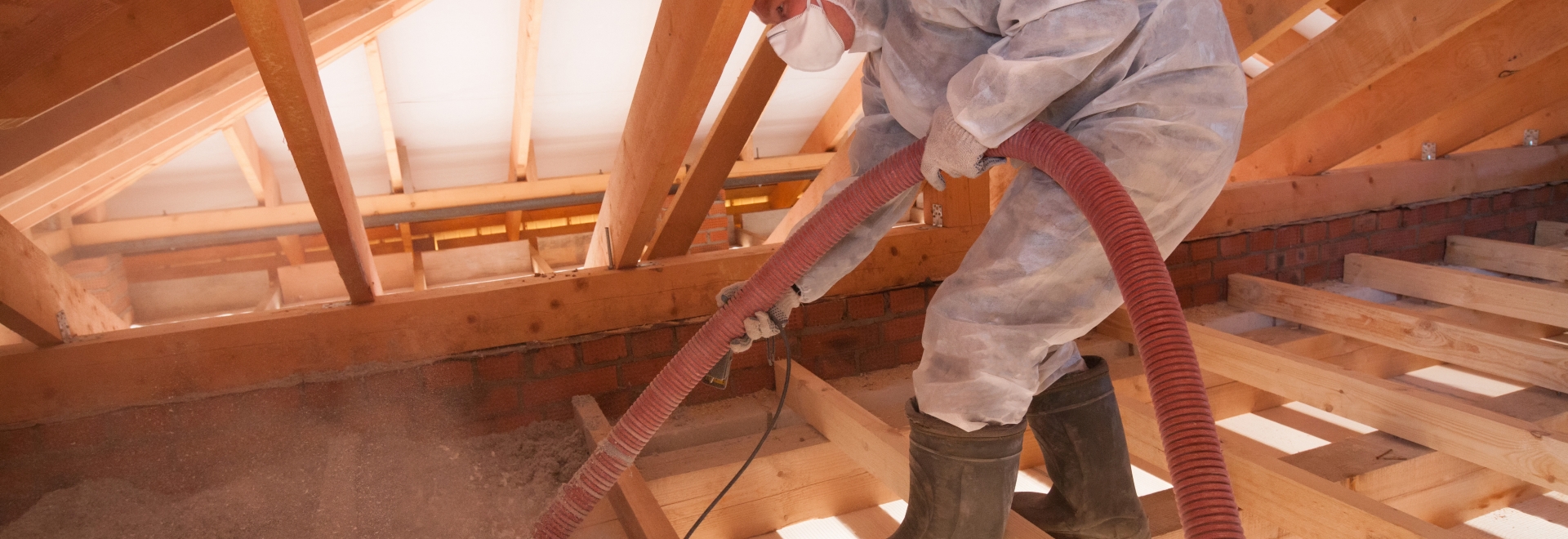 Technician Applying Blown-In Cellulose Insulation