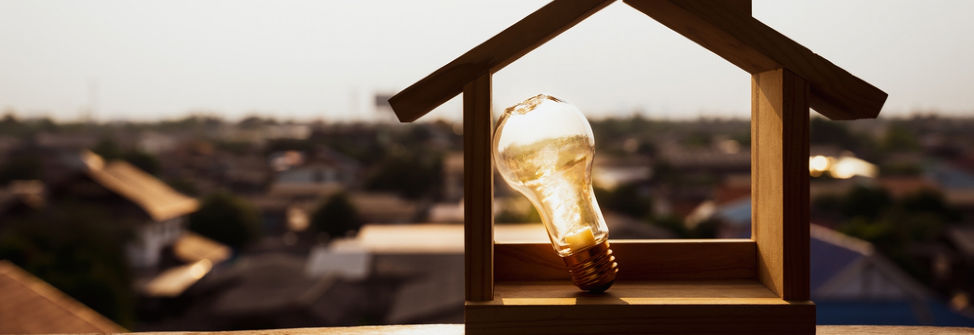 home electrification concept, light bulb with house model