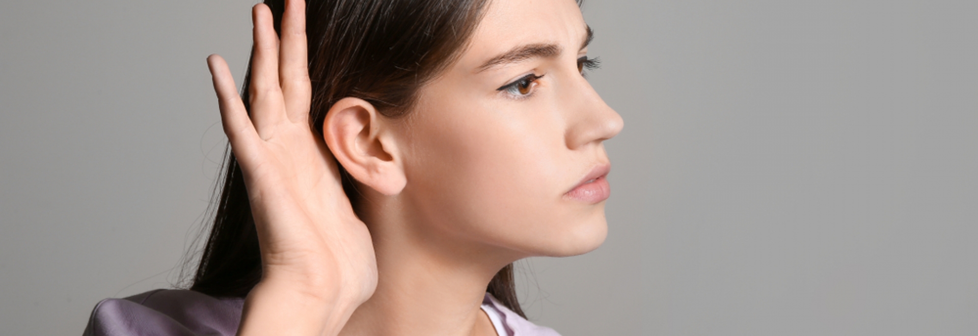 woman at home listening closely