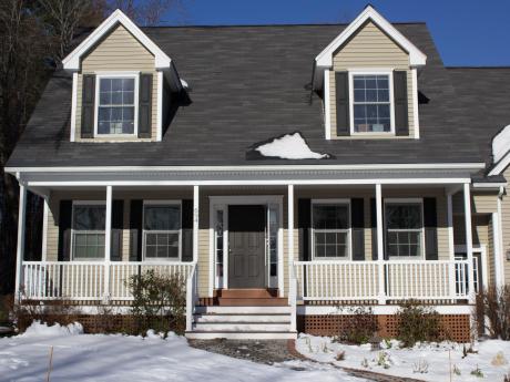 Front of house with porch, and a noticeable lack of ice dams!