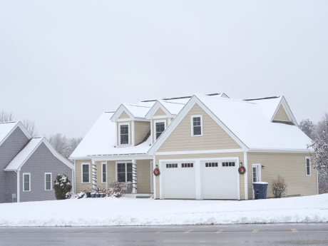 suburban home in the snow