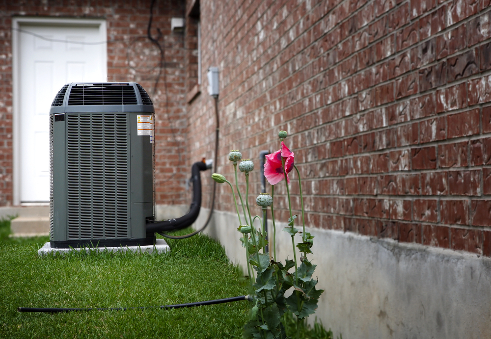 An external air conditioner is pictured. Princeton Air HVAC techs can help decide whether to repair or replace air conditioner units at your home