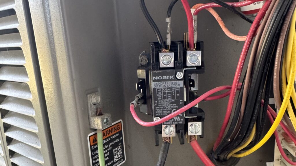 Close view of an AC contactor. A faulty one could be why your ac keeps shutting off