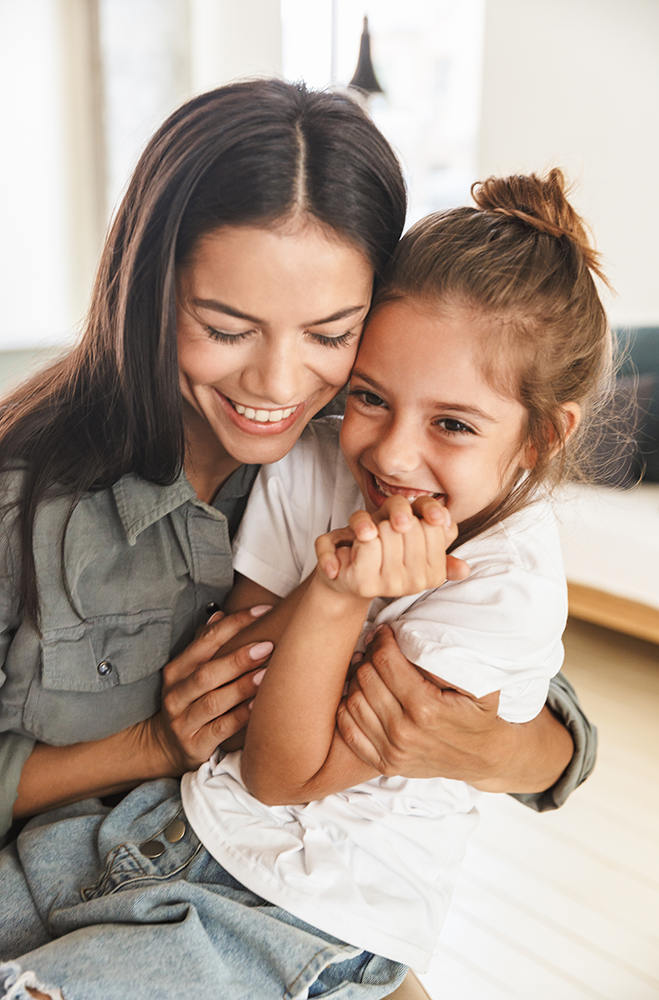 a mother embracing her young child