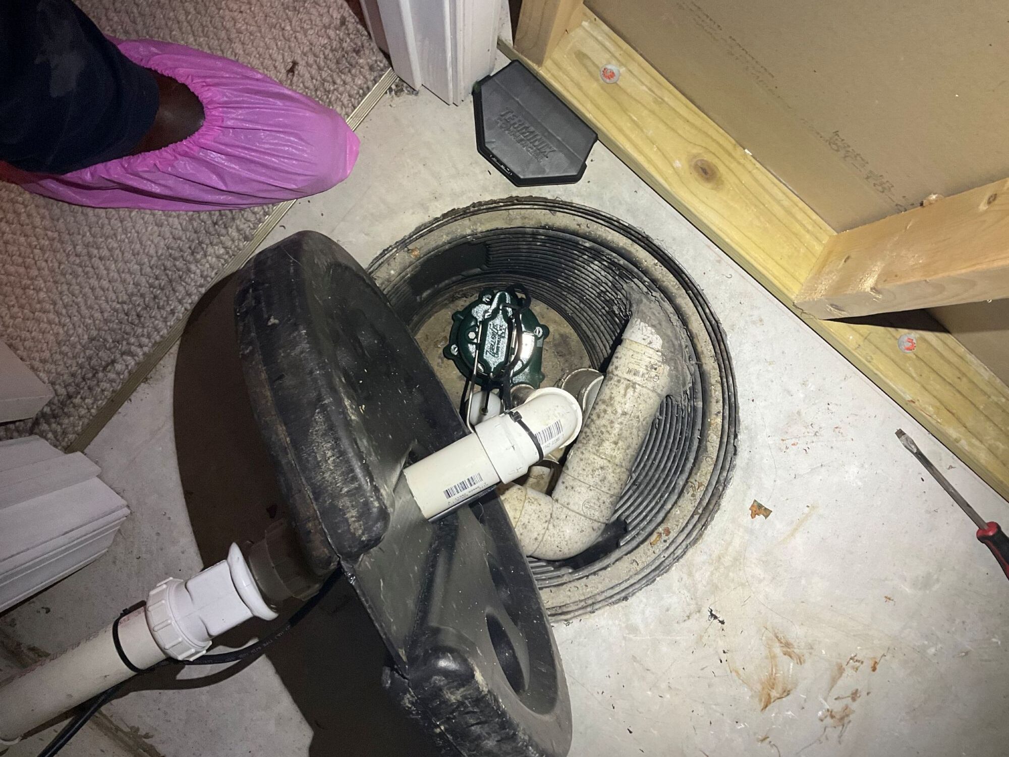 A Princeton Air tech gets a customer's sump pump ready for spring