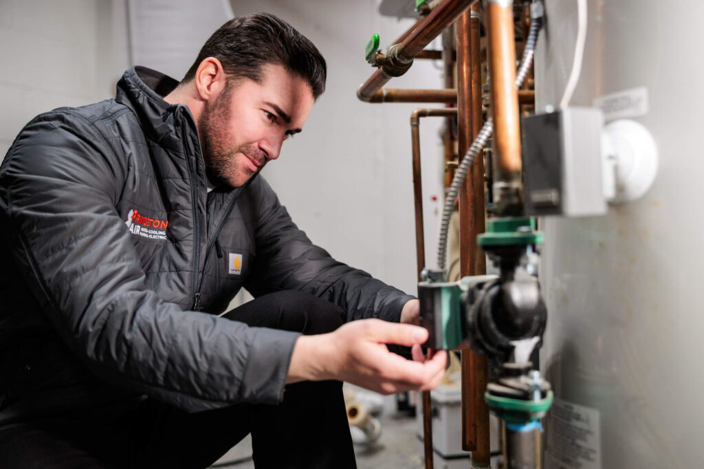 PA tech repairing boiler