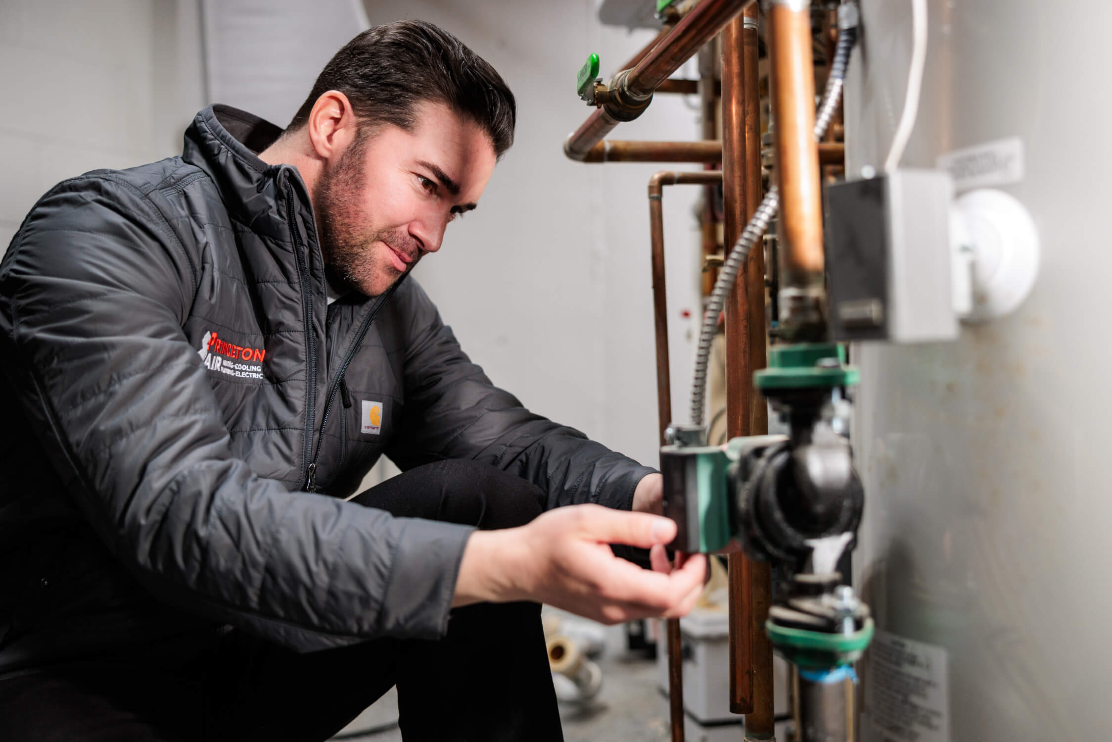 PA tech repairing boiler